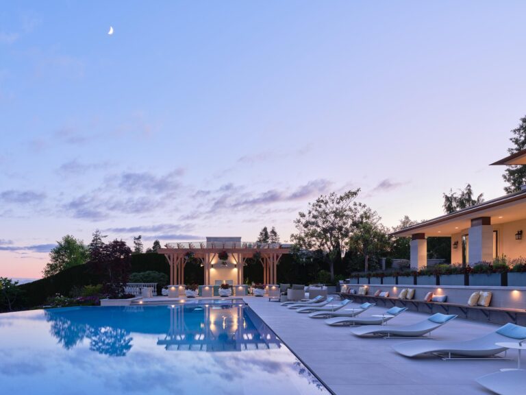 Vancouver estate with pool overlooking ocean in evening light by Teragon